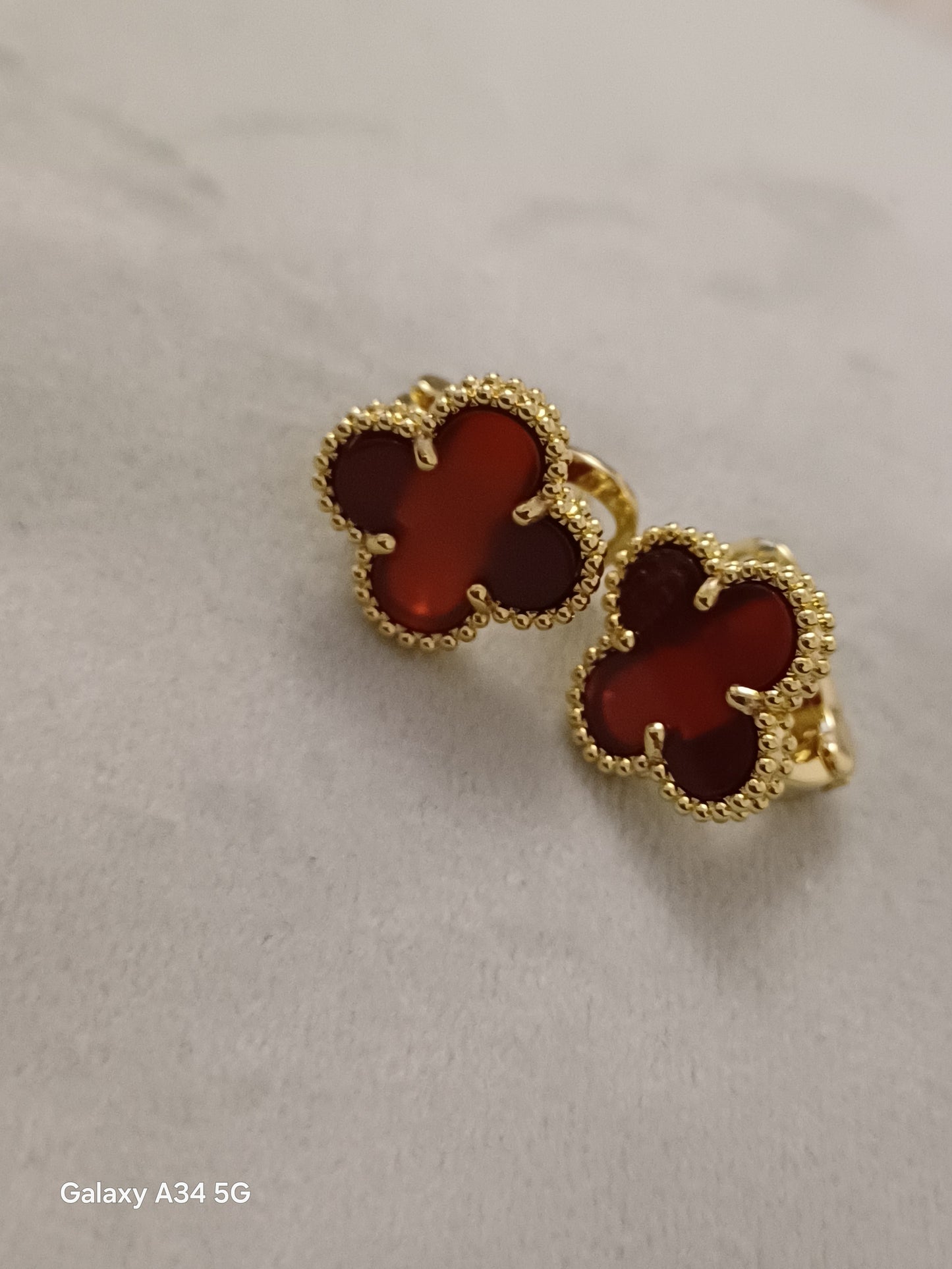 Boucle vca rouge transparent
